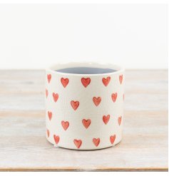 Stylish stoneware planter with natural color and heart design.
