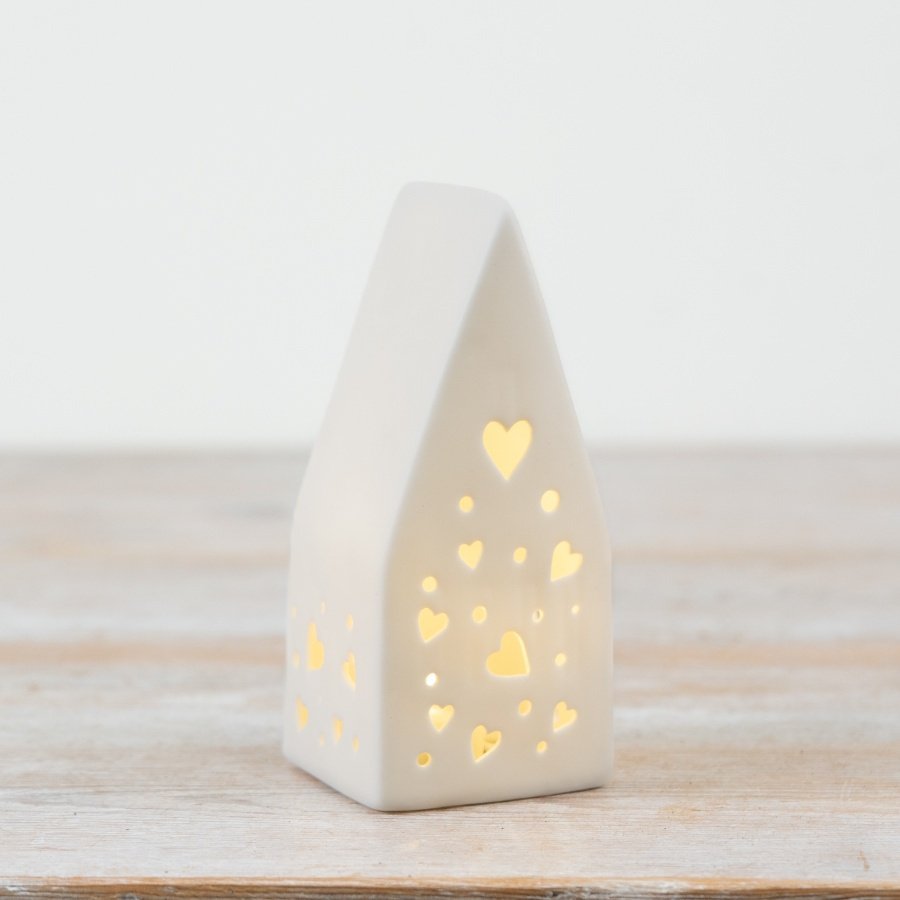 A charming heart-shaped light-up house decoration with a sweet cutout design.