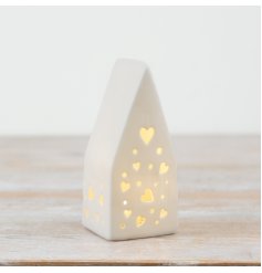 Charming heart-shaped cutout LED house decoration with a warm, glowing light.