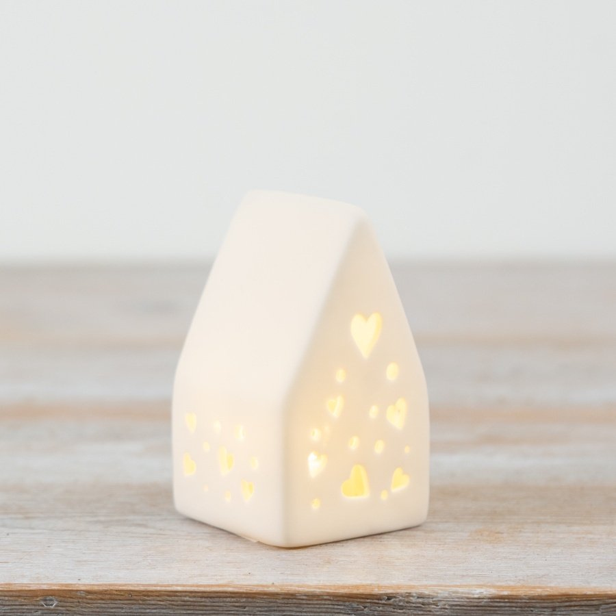 Brighten your room with this lovely White Porcelain LED House décor piece.