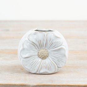 A charming daisy shaped vase with a white glossy glaze and raw details. 