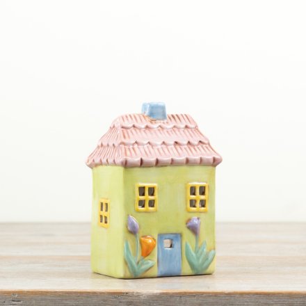 This charming tea light holder features a beautiful blend of pastel colors for a perfect stylish touch.