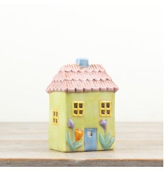 Displaying a lovely mix of pastel colours this charming tea light holder would style well perfectly