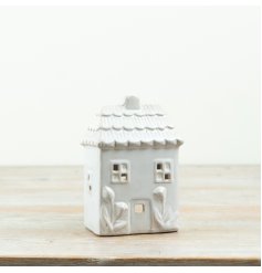 Displaying a lovely mix of pastel colours this charming tea light holder would style well perfectly