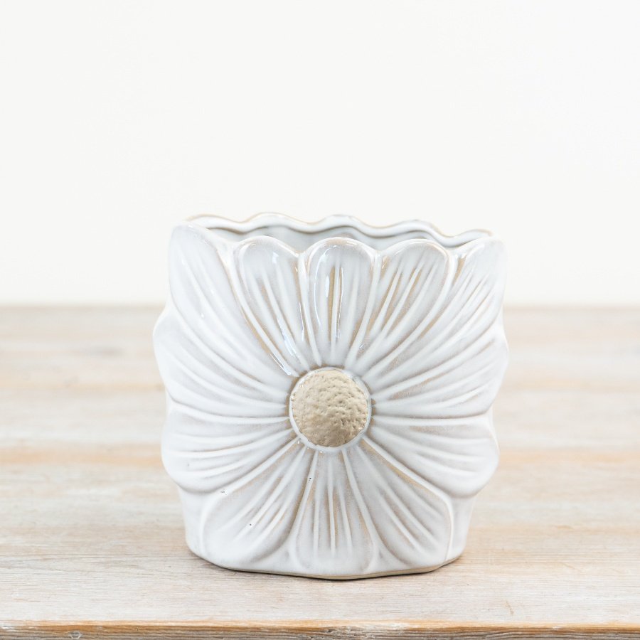 A pretty daisy shaped glazed vase with raw details and texture. A wonderful garden inspired gift for the home. 