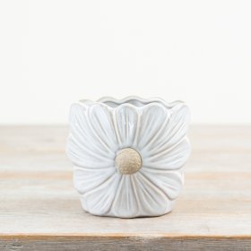 A pretty daisy shaped vase with a rich white glaze and raw details. 