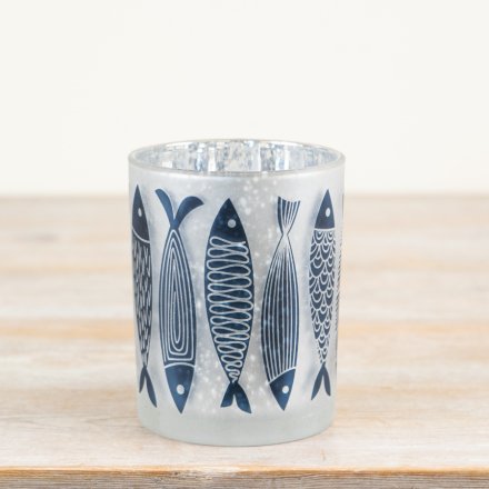 Bring the ocean home with this charming fish-patterned candle holder
