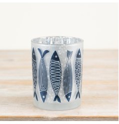 Bring the ocean home with this charming fish-patterned candle holder