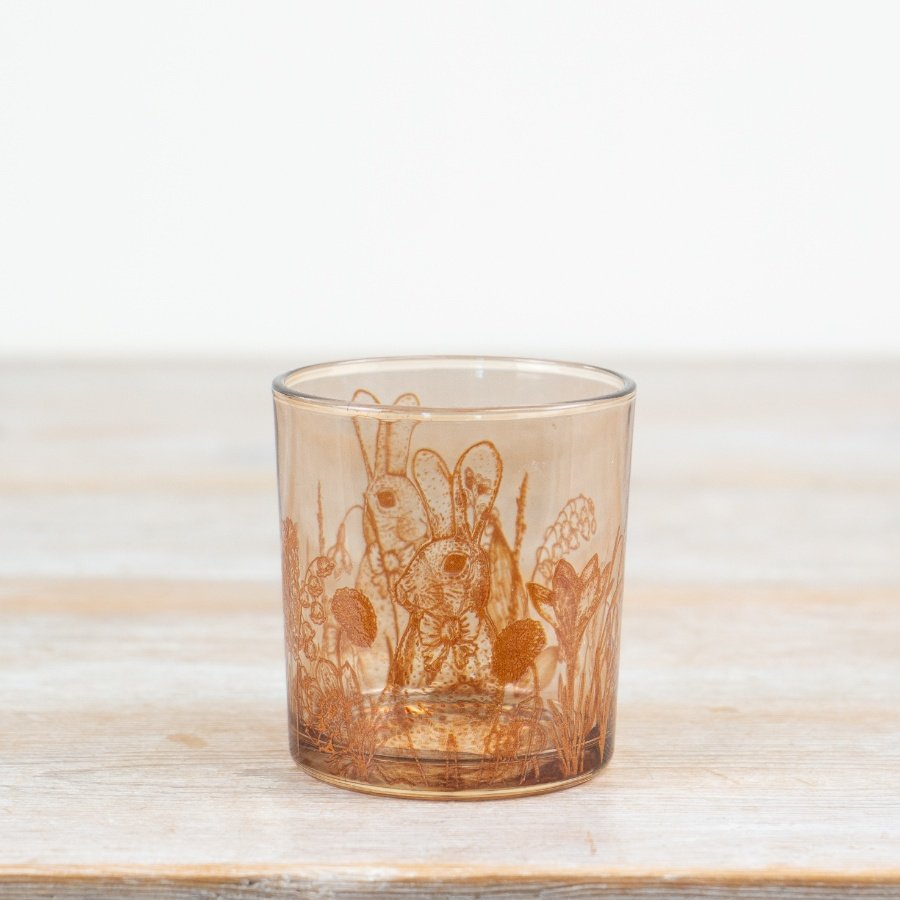 Enhance your decor with this elegant glass candle holder adorned with a charming rabbit design.