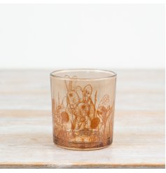 Bring charm to your space with this elegant glass candle holder adorned with a delightful rabbit design.