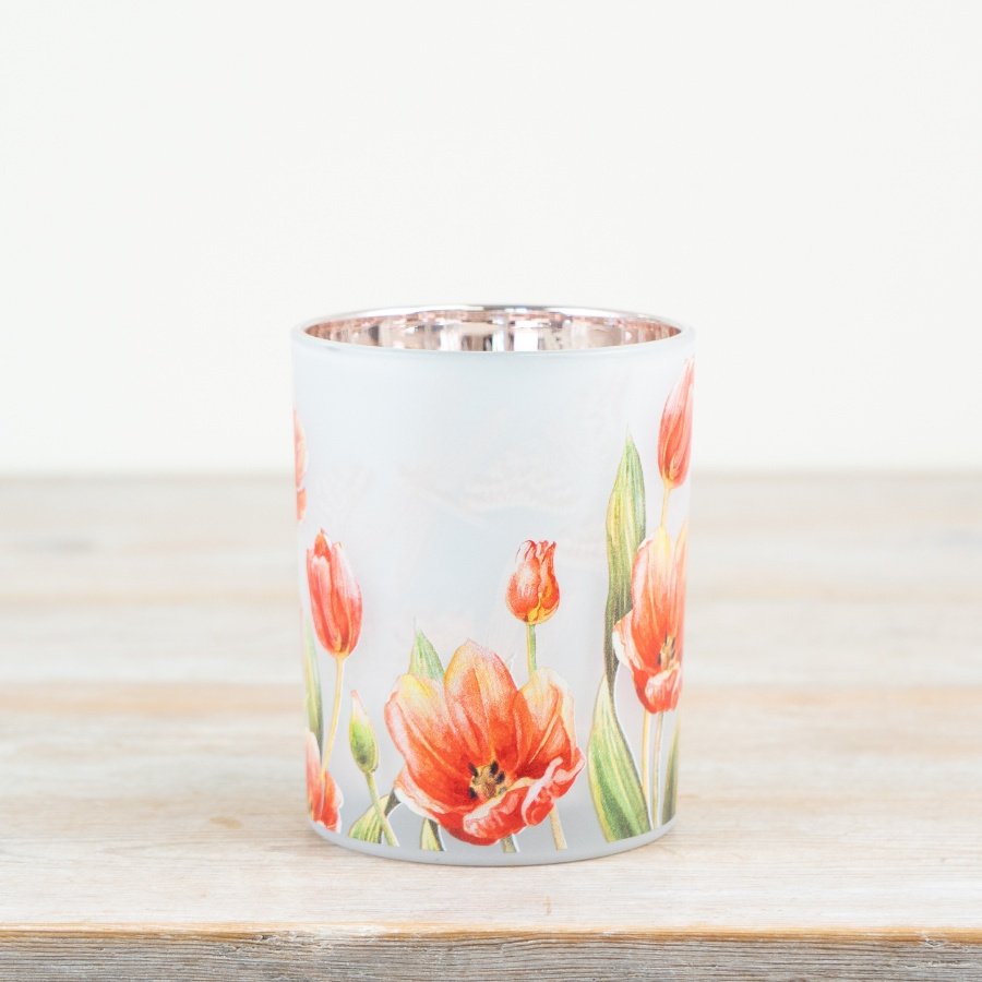 Stylish glass candle holder featuring a charming floral design.