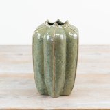 Inspired by nature this porcelain vase has a rich earthy colour and beautiful green glaze. 