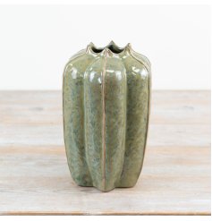 Bring the joy of nature into the home with this richly glazed green seeded vessel vase.