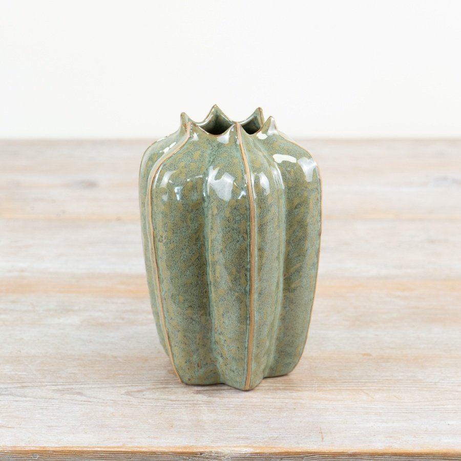 This stylish porcelain vase brings the beauty of nature into the home.