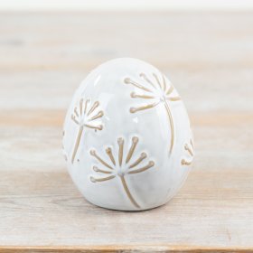 Delightful porcelain egg decoration, perfect for adding elegance to any space.