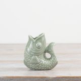 Elevate your space with this on trend fish vase in a sage green colour tone. 