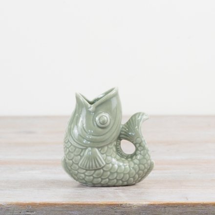 Elevate your space with this on trend fish vase in a sage green colour tone. 
