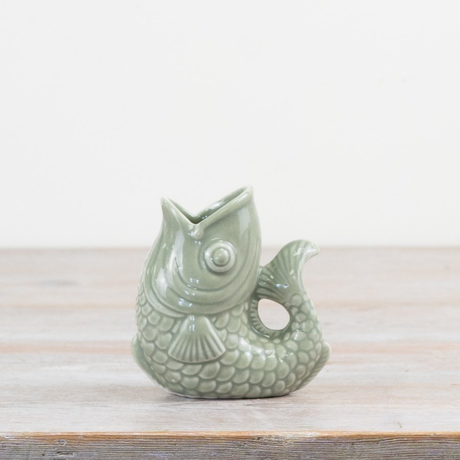Enhance your décor with this stylish sage green fish vase, perfect for adding a trendy touch to any space.