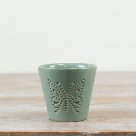 Delicate candle holder in soothing sage green, featuring an elegant butterfly cut-out design.