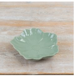 Craft a serene, welcoming vibe with this sage green floral dish.