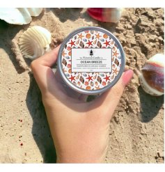 Ocean-themed scented candle in a reusable tin for a fresh, coastal aroma.