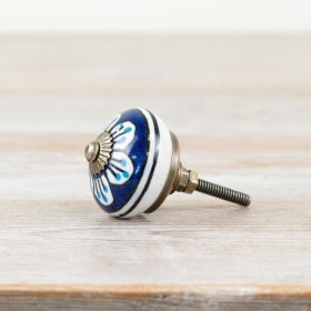 Blue door knob with vintage-style pattern design