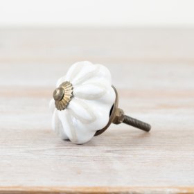 Enhance your furniture with elegant white flower ceramic knobs in a stylish bronze finish.
