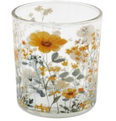 Add a pop of color to your room with this vibrant orange candle holder.