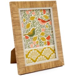 Charming rattan picture frame featuring a songbird design.