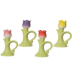 Add elegance to any room with this set of four sleek porcelain candleholders,