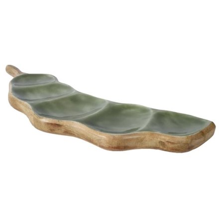 A unique and stylish bean shaped grazing board made from natural mango wood with an enamel glaze.