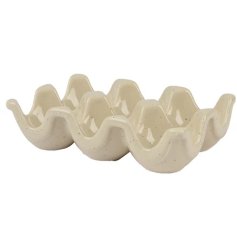 A stylish egg holder with a glossy, speckled glaze. 