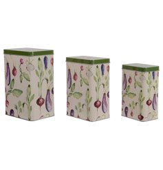 A set of 3 charming vegetable themed storage tins with lids. 