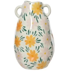 A charming and unique vase with an irregular shape, small handles and a bold and beautiful design. 