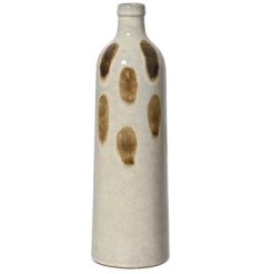 Add a charming touch to your home with the Vase Terracotta Dots