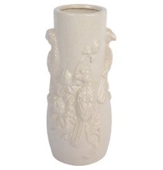 A beautifully detailed porcelain vase with a 3D tropical bird design. Finished with a cream reactive glaze. 