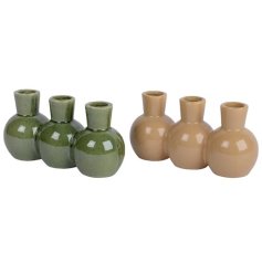 An assortment of 2 unique vases each with a richly coloured reactive glaze in latte and green colours. 