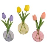 An assortment of 3 artificial tulip arrangements in glass vases. The mix includes pretty yellow, purple and pink designs