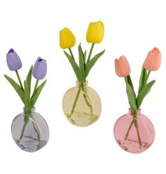 An assortment of 3 artificial tulip arrangements in glass vases. The mix includes pretty yellow, purple and pink designs