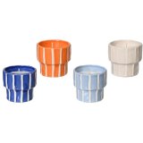 An assortment of 4 citronella candles in colourful stripe designs. 