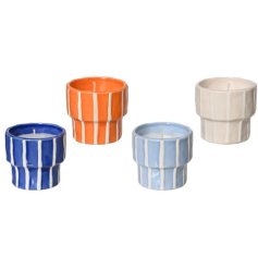 A mix of 4 decorative candle pots in colourful stripe designs. Each is filled with a citronella candle. 