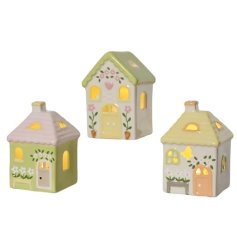 A mix of 3 pretty houses with light up feature. Decorated with a mix of flower designs. 