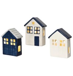 A mix of 3 charming coastal inspired houses with warm glow LED lights.