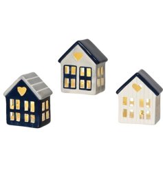 A mix of 3 coastal inspired houses in navy, grey and white colours. Complete with warm glow LED lights.