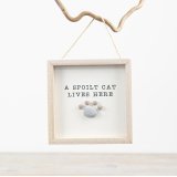 This adorable wooden sign featuring pebbles and a cute feline quote is a great gift item for a cat lover. 