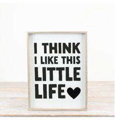 Elegant black and white wooden sign with a charming design.