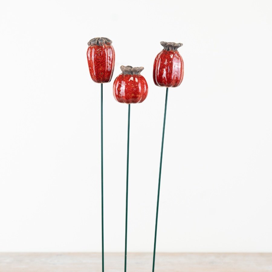 Elegant floral patterns on metal stakes, perfect for enhancing your garden’s beauty.