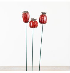 Elegant floral patterns on metal stakes, perfect for garden decor.