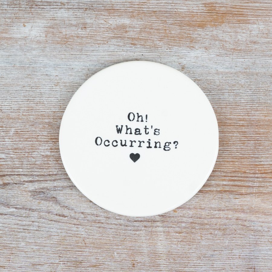 A stylish and humorous porcelain coaster with an embossed design.