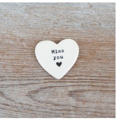 Porcelain heart token featuring a sweet quote and delicate heart design—charming and meaningful keepsake.